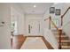 Bright entryway with hardwood floors, staircase, and inviting front door at 137 Branchview Dr, Mooresville, NC 28115
