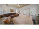 Spacious living room featuring a large sectional sofa and neutral carpeting at 137 Branchview Dr, Mooresville, NC 28115