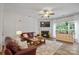 Inviting living room with a fireplace, hardwood floors, and comfortable seating at 137 Branchview Dr, Mooresville, NC 28115