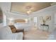 Bright main bedroom with a king bed, tray ceiling, and neutral décor at 137 Branchview Dr, Mooresville, NC 28115