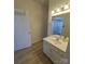 Standard bathroom featuring a vanity with white cabinetry, gold hardware, and a large mirror at 1410 4Th Street Nw Dr # 303, Hickory, NC 28601