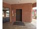A lobby area with brick walls showing access to an elevator at 1410 4Th Street Nw Dr # 303, Hickory, NC 28601