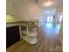 Stylish kitchen with an island counter and a view into the main living area at 1410 4Th Street Nw Dr # 303, Hickory, NC 28601