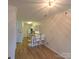 View of kitchen with breakfast bar and living area with light fixture at 1410 4Th Street Nw Dr # 303, Hickory, NC 28601
