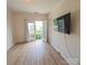 Cozy living room with a flatscreen television and access to a balcony at 1410 4Th Street Nw Dr # 303, Hickory, NC 28601