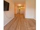 Spacious living room with vinyl flooring and a view of the kitchen at 1410 4Th Street Nw Dr # 303, Hickory, NC 28601