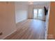 Bright living room features wood floors, recessed lighting, and double doors to a balcony at 1410 4Th Street Nw Dr # 303, Hickory, NC 28601