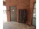 Mailboxes and a brown door are situated in a brick alcove at 1410 4Th Street Nw Dr # 303, Hickory, NC 28601