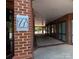 Signage shows the entryway into the building with a covered walkway and brick accents at 1410 4Th Street Nw Dr # 303, Hickory, NC 28601