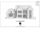 Two-story brick home featuring multiple windows and a covered front porch with an arched entrance at 1418 Samuel Spencer Pkwy, Davidson, NC 28036