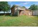 A house with a brick exterior and a second-story deck, enhancing outdoor living and curb appeal at 14411 Eastfield Rd, Huntersville, NC 28078