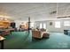 Large basement featuring carpet, fireplace, game area, and potential for customization at 14411 Eastfield Rd, Huntersville, NC 28078