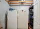 Basement storage with 2 freezers and shelving next to white door at 14411 Eastfield Rd, Huntersville, NC 28078