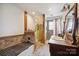 Unique bathroom featuring wood accents, stone shower, and vintage vanity with sink at 14411 Eastfield Rd, Huntersville, NC 28078