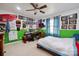 Fun bedroom with green and white walls, desk and bed with a ceiling fan at 14411 Eastfield Rd, Huntersville, NC 28078