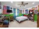 Vibrant bedroom with colorful walls, ceiling fan, and wall decor at 14411 Eastfield Rd, Huntersville, NC 28078