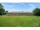 Charming brick home with a welcoming front porch and well-manicured lawn at 14411 Eastfield Rd, Huntersville, NC 28078