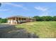 Lovely brick home featuring an attached garage and a spacious front yard at 14411 Eastfield Rd, Huntersville, NC 28078