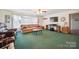 Bright living room featuring a plush sofa, a media center, and natural light at 14411 Eastfield Rd, Huntersville, NC 28078