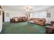 Cozy living room with comfortable seating, large windows, and ceiling fan at 14411 Eastfield Rd, Huntersville, NC 28078