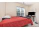 Cozy bedroom featuring a large window for natural light, neutral paint, and carpeted floors at 14624 Via Sorrento Dr # 6206, Charlotte, NC 28277