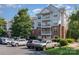 Apartment building with brick and white siding, balconies, landscaping, and a parking area at 14624 Via Sorrento Dr # 6206, Charlotte, NC 28277