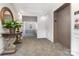 Well-lit hallway with neutral tones, decorative table, and convenient elevator access for residents at 14624 Via Sorrento Dr # 6206, Charlotte, NC 28277