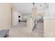 Spacious living room featuring a fireplace, a kitchen and dining space, perfect for entertaining at 14624 Via Sorrento Dr # 6206, Charlotte, NC 28277
