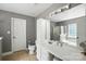 Neutral Primary bathroom featuring a large vanity, soaking tub, and stand-up shower at 15508 Normans Landing Dr, Charlotte, NC 28273