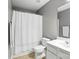 Bright bathroom with shower and tub features neutral walls and modern fixtures at 15508 Normans Landing Dr, Charlotte, NC 28273