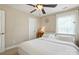 Comfortable bedroom with ceiling fan and a neutral color scheme at 15508 Normans Landing Dr, Charlotte, NC 28273