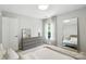 Bright bedroom with plush carpet, dresser, and plenty of natural light at 15508 Normans Landing Dr, Charlotte, NC 28273