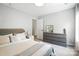Cozy bedroom with plush carpet, a dresser, and a full bed at 15508 Normans Landing Dr, Charlotte, NC 28273