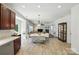 Open concept dining room flows into the living room, perfect for entertaining at 15508 Normans Landing Dr, Charlotte, NC 28273