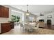 Bright dining area connects to outdoor space, adjacent kitchen and comfortable living room at 15508 Normans Landing Dr, Charlotte, NC 28273