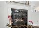 Close-up of a modern fireplace with black tile surround and decorative mantle at 15508 Normans Landing Dr, Charlotte, NC 28273