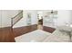 Inviting space with hardwood floors, staircase, and neutral decor, offering a comfortable and stylish environment at 15508 Normans Landing Dr, Charlotte, NC 28273