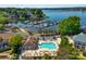 Aerial view of lakefront community with pool, boat marina, and lush greenery at 15818 Sparrowridge Ct, Charlotte, NC 28278
