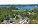 Aerial view of house, located near a lake and surrounded by lush greenery at 15818 Sparrowridge Ct, Charlotte, NC 28278