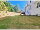 Backyard view featuring a deck and gently sloping lawn at 15818 Sparrowridge Ct, Charlotte, NC 28278
