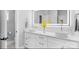 Well-lit bathroom with double vessel sinks, quartz countertops, and a modern light at 15818 Sparrowridge Ct, Charlotte, NC 28278
