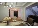 Cozy dining room showcasing a modern chandelier, dining table, and a view of the entry at 15818 Sparrowridge Ct, Charlotte, NC 28278
