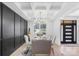 Elegant dining room featuring a modern chandelier and dark accent wall at 15818 Sparrowridge Ct, Charlotte, NC 28278