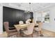 Charming dining room with natural light, a modern light fixture and dining table at 15818 Sparrowridge Ct, Charlotte, NC 28278