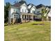 Charming two-story home with a welcoming front porch, beautiful stone accents, and a well-maintained lawn at 15818 Sparrowridge Ct, Charlotte, NC 28278