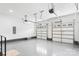 Spacious garage featuring multiple garage doors and a clean, epoxy-coated floor for vehicle storage at 15818 Sparrowridge Ct, Charlotte, NC 28278