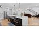 Open concept kitchen with stainless steel appliances, a central island, and a view of the living area at 15818 Sparrowridge Ct, Charlotte, NC 28278
