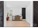 Stylish living area showcasing a decorative cabinet and lots of bright sunlight at 15818 Sparrowridge Ct, Charlotte, NC 28278