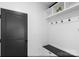 Mudroom featuring coat hooks, a bench with storage, and overhead shelves for efficient organization at 15818 Sparrowridge Ct, Charlotte, NC 28278