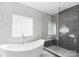 Modern bathroom with sleek glass shower and white marble tiling detail at 15818 Sparrowridge Ct, Charlotte, NC 28278